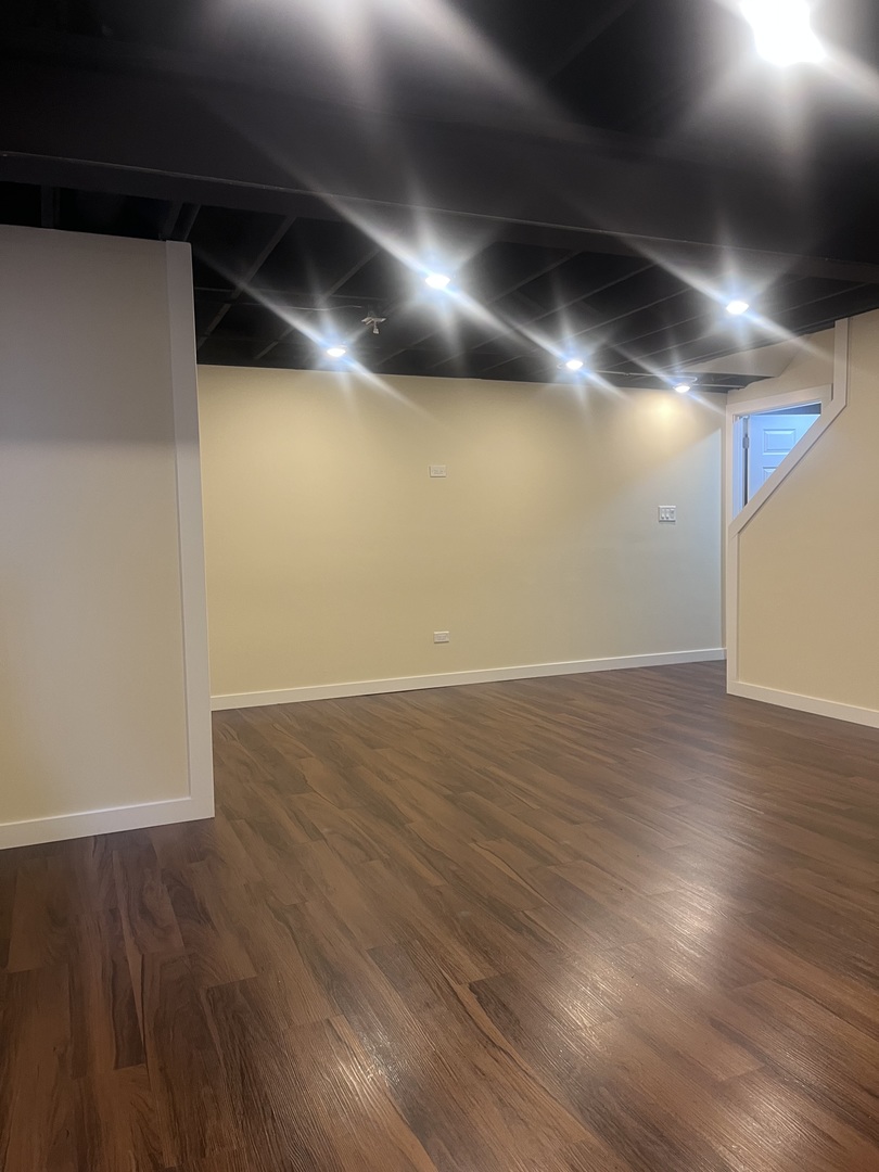 547 Goodwin Drive Bolingbrook, IL 60440 - Photo 27 of 36 an empty room with wooden floor