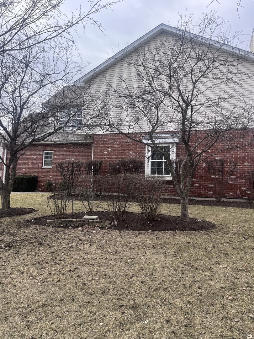 547 Goodwin Drive Bolingbrook, IL 60440 - Photo 32 of 36 a front view of a house with a yard