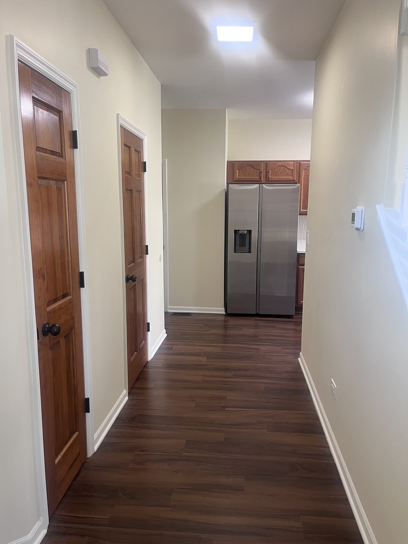 547 Goodwin Drive Bolingbrook, IL 60440 - Photo 10 of 36 a view of a hallway with wooden floor