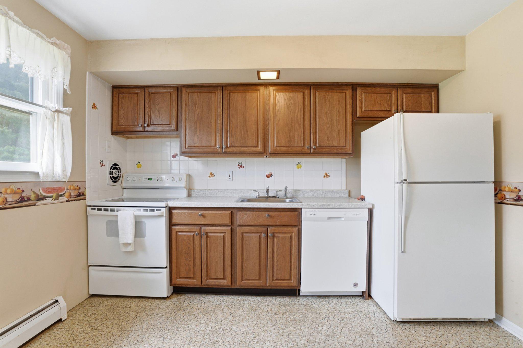 330 Wexford Road Red Hill, PA 18076 - Photo 11 of 54 a kitchen with stainless steel appliances granite countertop a refrigerator stove a sink and dishwasher