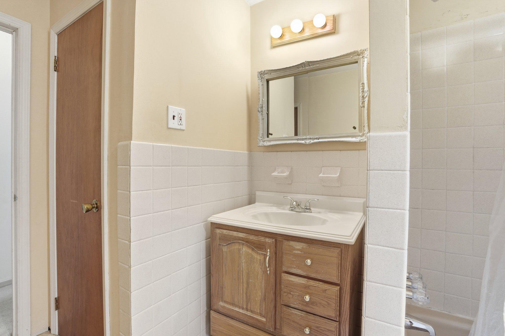330 Wexford Road Red Hill, PA 18076 - Photo 20 of 54 a bathroom with a sink vanity and mirror