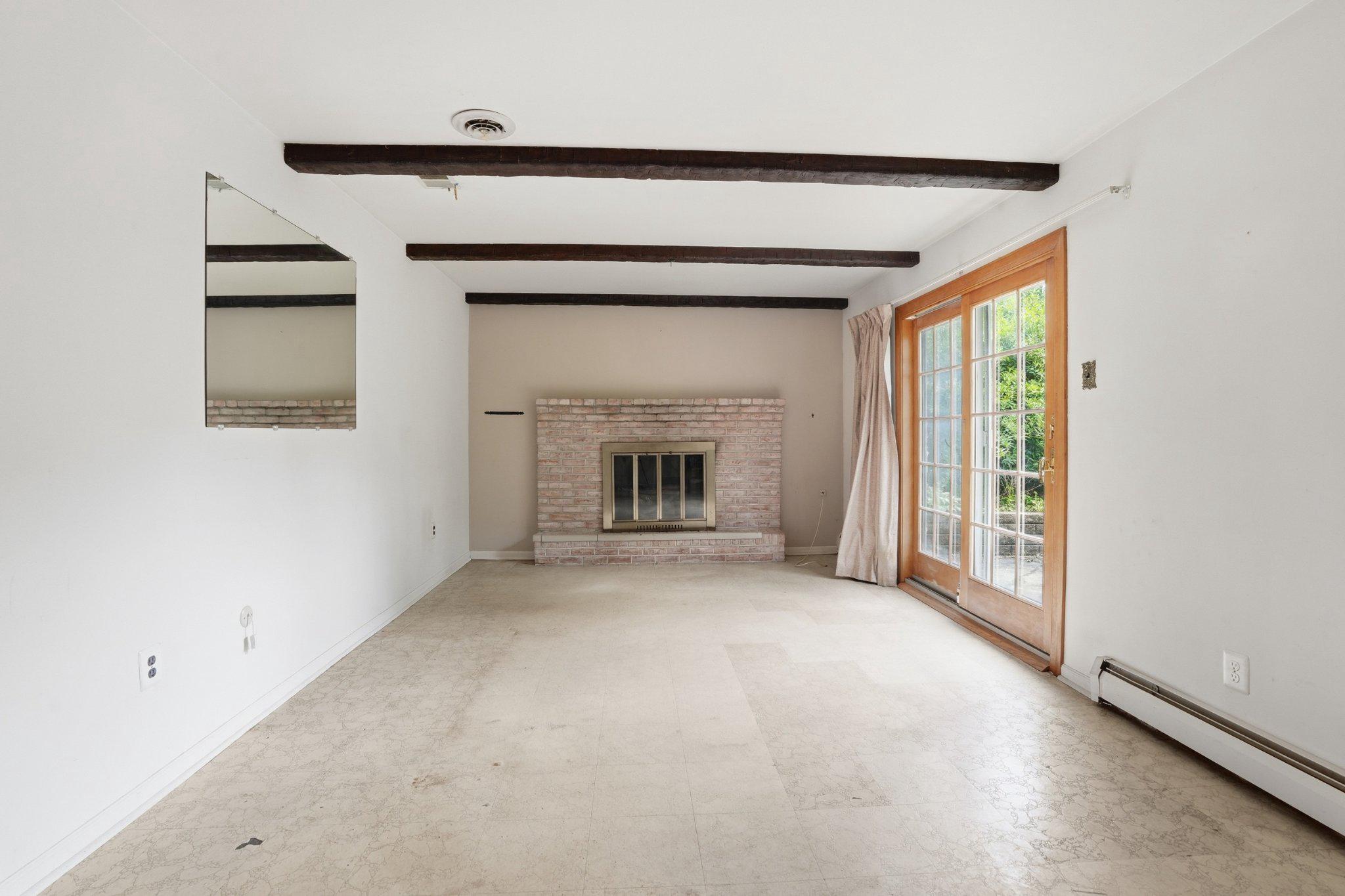 330 Wexford Road Red Hill, PA 18076 - Photo 22 of 54 a view of empty room with a fireplace and a window