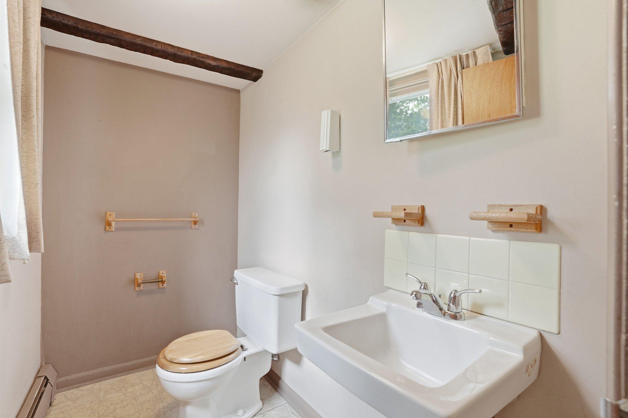 330 Wexford Road Red Hill, PA 18076 - Photo 26 of 54 a bathroom with a sink toilet and a mirror