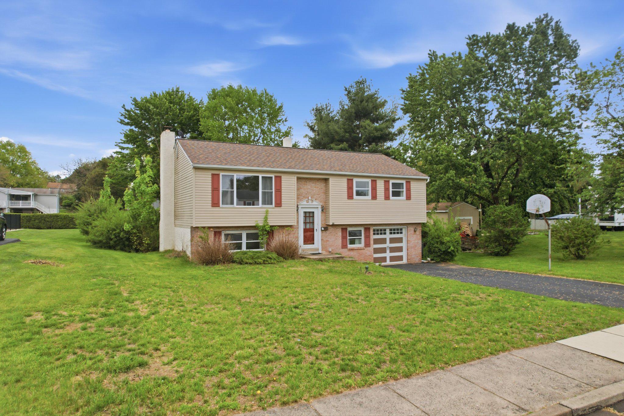330 Wexford Road Red Hill, PA 18076 - Photo 3 of 54 a house view with a garden space