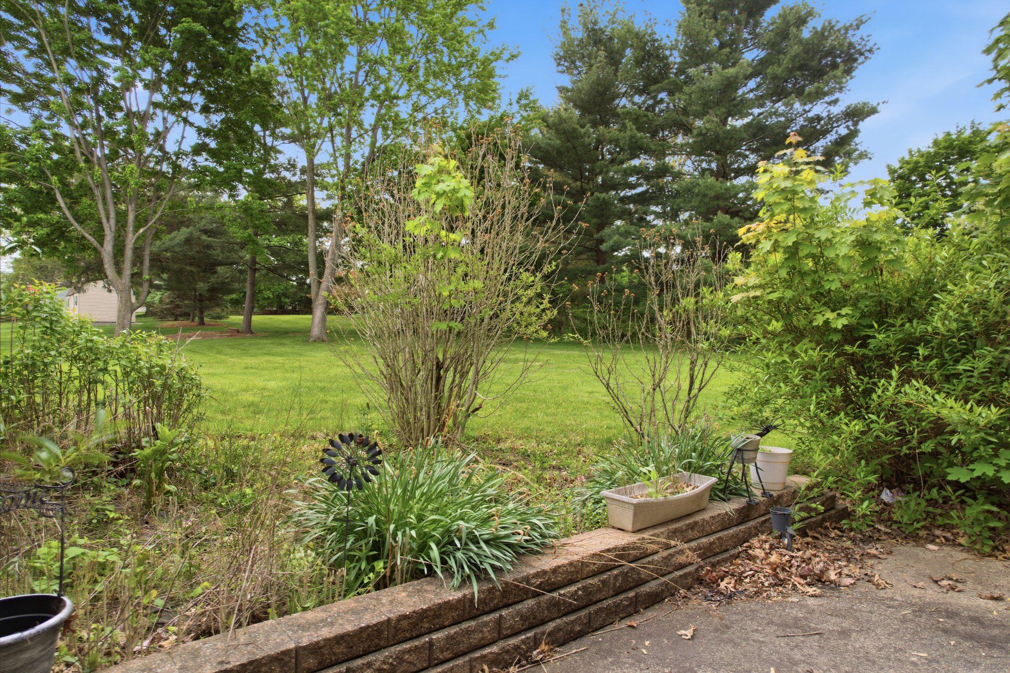 330 Wexford Road Red Hill, PA 18076 - Photo 44 of 54 a view of a garden with a bench