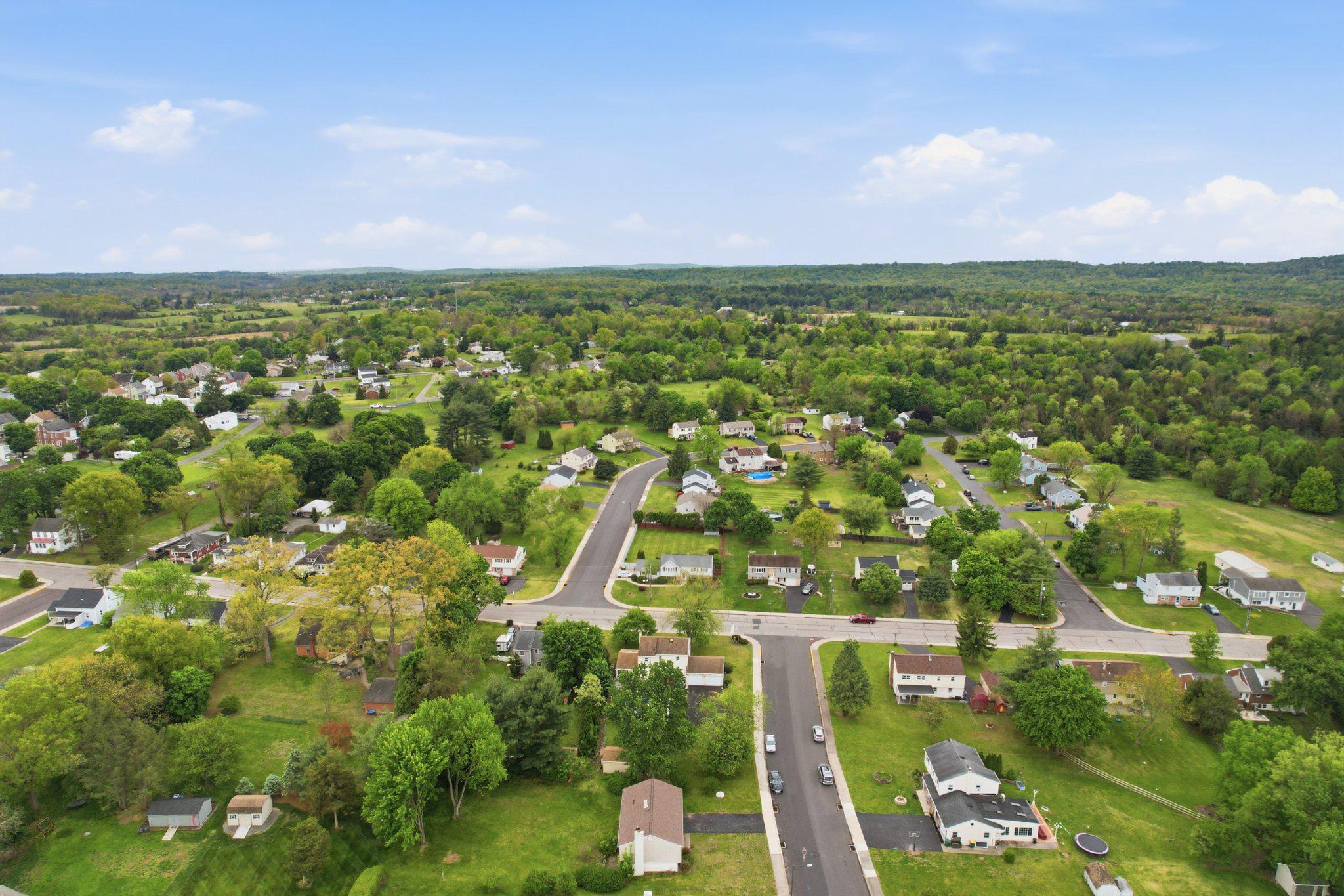 330 Wexford Road Red Hill, PA 18076 - Photo 51 of 54 an aerial view of a city with lots of residential buildings