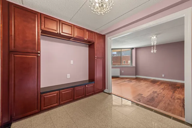 a kitchen with a sink cabinets and refrigerator
