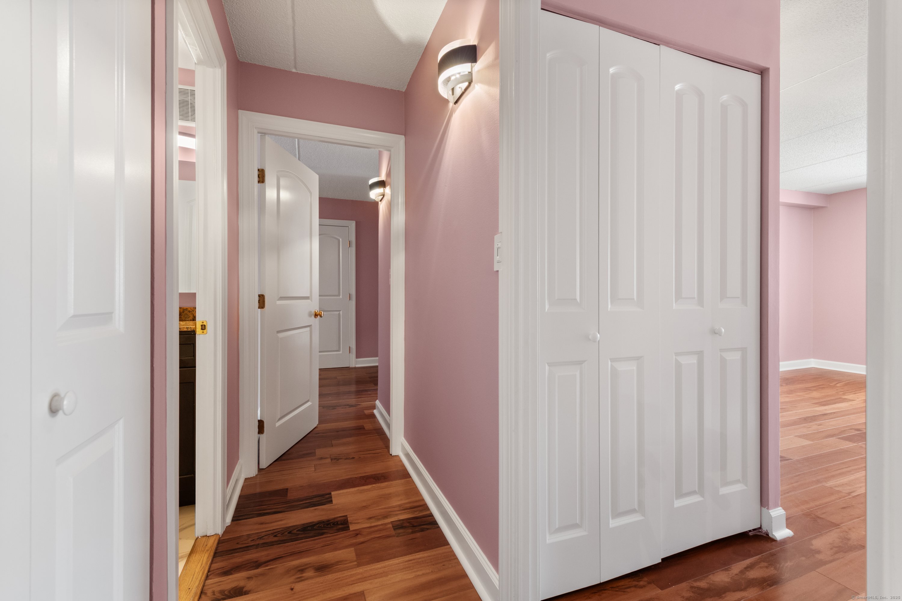143 Hoyt Street, Unit 1A Stamford, CT 06905 - Photo 18 of 32 a view of a hallway with wooden floor