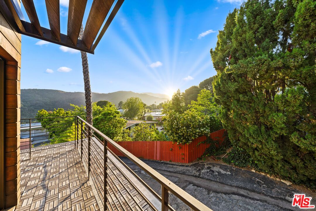 13501 Bayliss Road Los Angeles, CA 90049 - Photo 20 of 33 a view of balcony with a swing