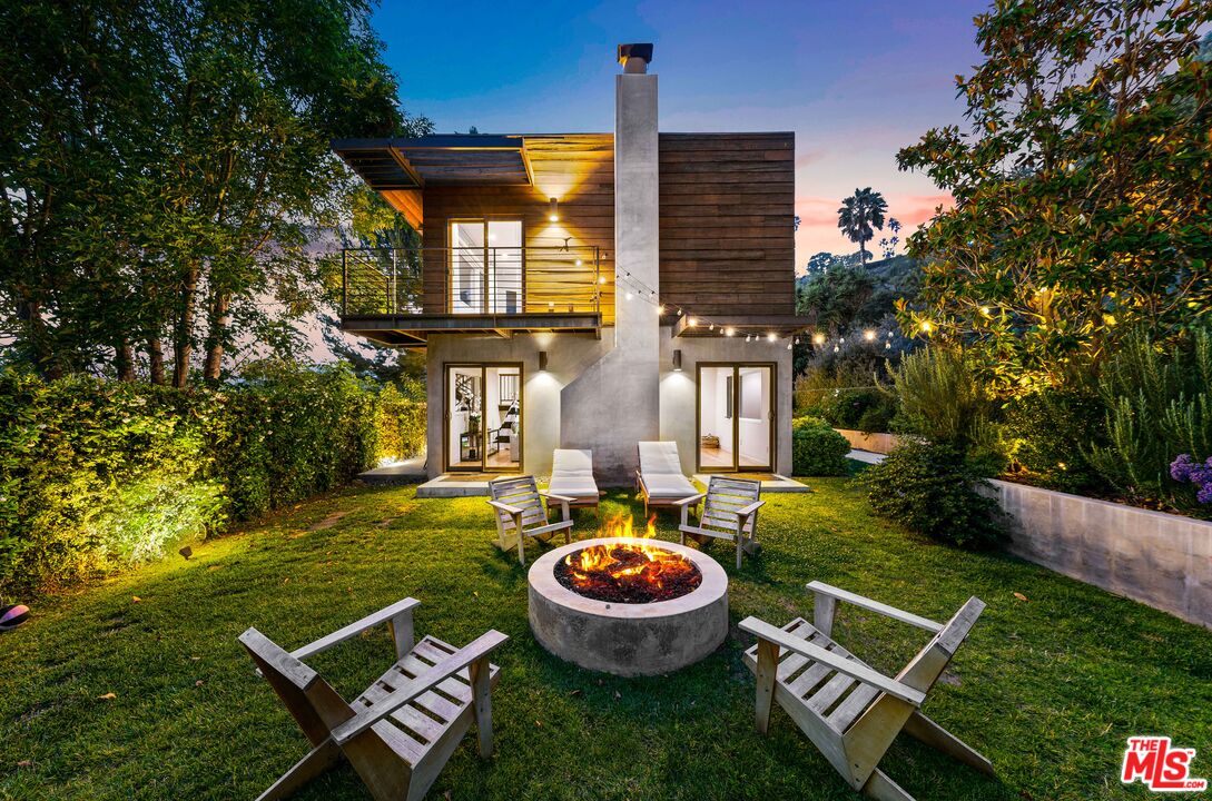 13501 Bayliss Road Los Angeles, CA 90049 - Photo 31 of 33 a view of an house with backyard space and patio