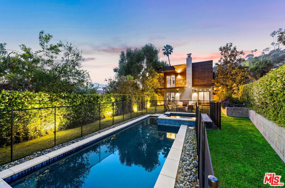 13501 Bayliss Road Los Angeles, CA 90049 - Photo 32 of 33 a view of a balcony with chairs