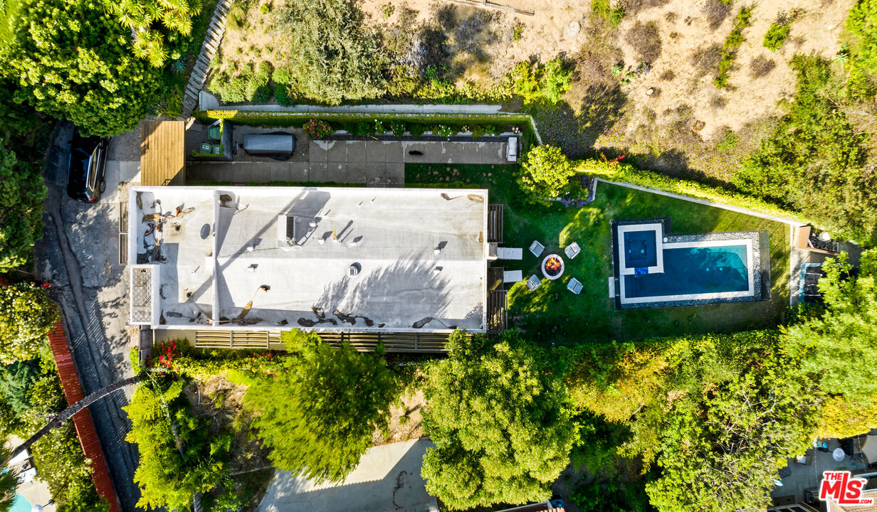 13501 Bayliss Road Los Angeles, CA 90049 - Photo 33 of 33 a front view of a house with a yard
