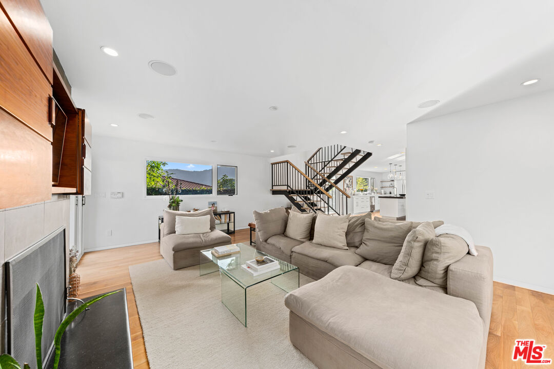 13501 Bayliss Road Los Angeles, CA 90049 - Photo 5 of 33 a living room with furniture wooden floor and a flat screen tv