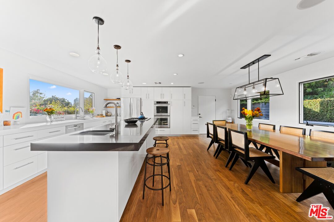 13501 Bayliss Road Los Angeles, CA 90049 - Photo 7 of 33 a view of a living room and dining room