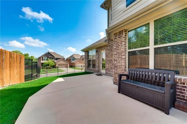 a view of a house with couches in a patio