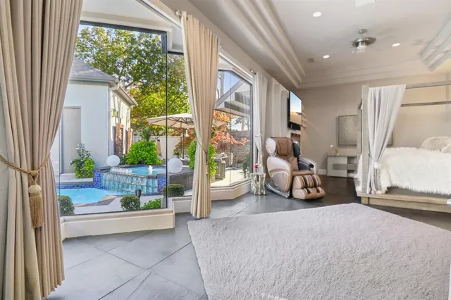 a view of a livingroom with furniture and a large window