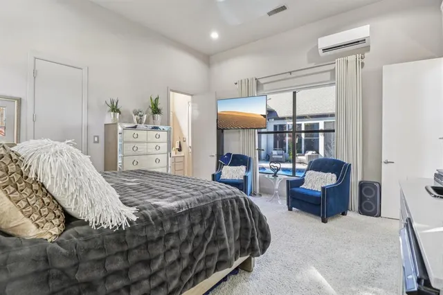 a bedroom with a bed and furniture