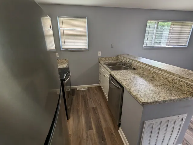 a storage room with wooden floor and window