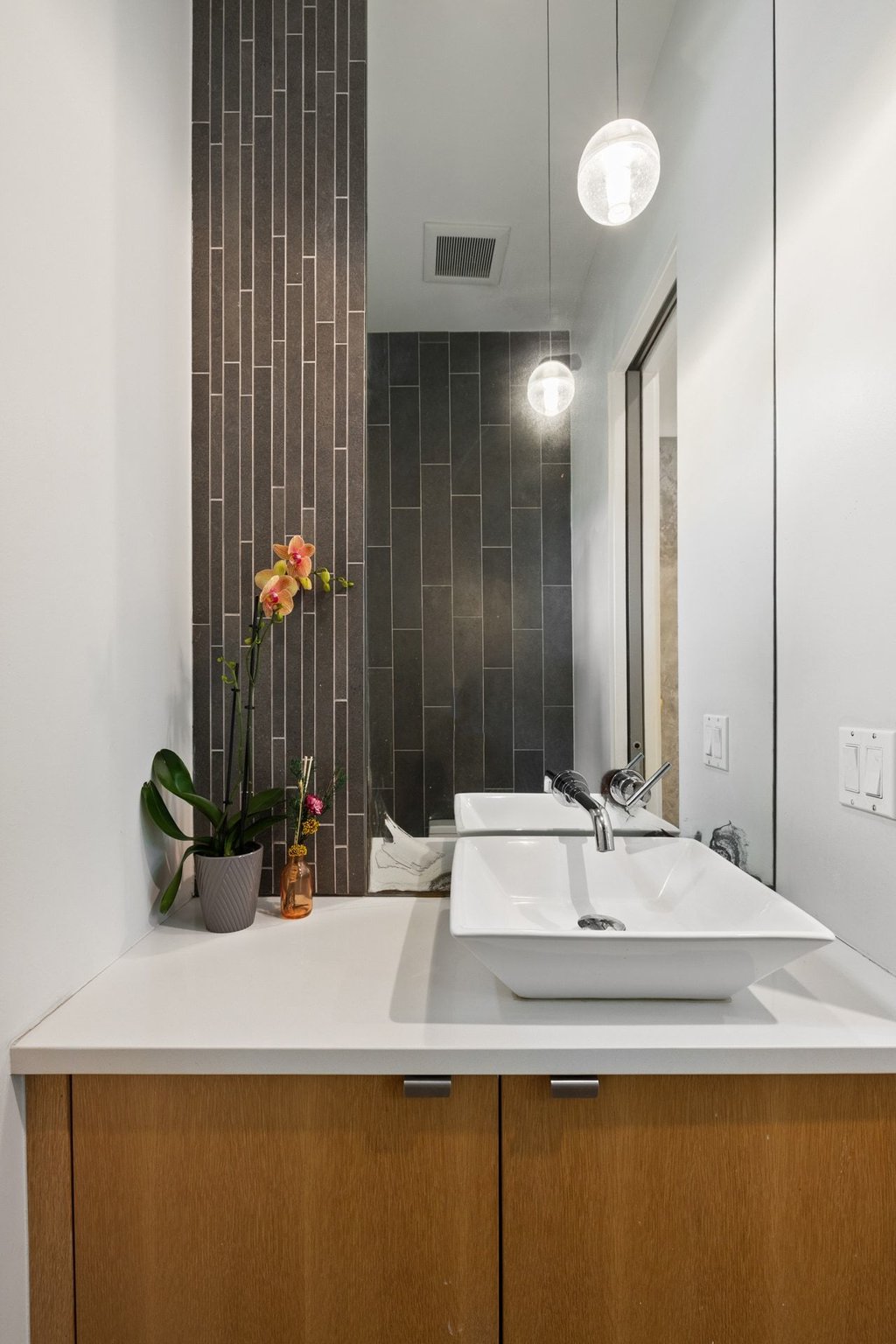 801 The High Road Austin, TX 78746 - Photo 17 of 40 a bathroom with a sink and a mirror