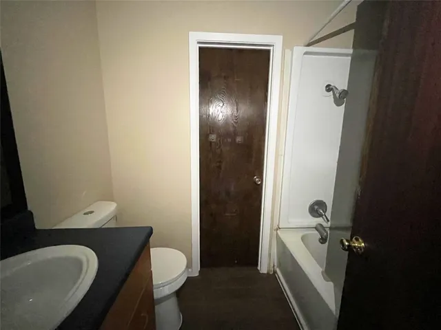 a bathroom with a sink and toilet