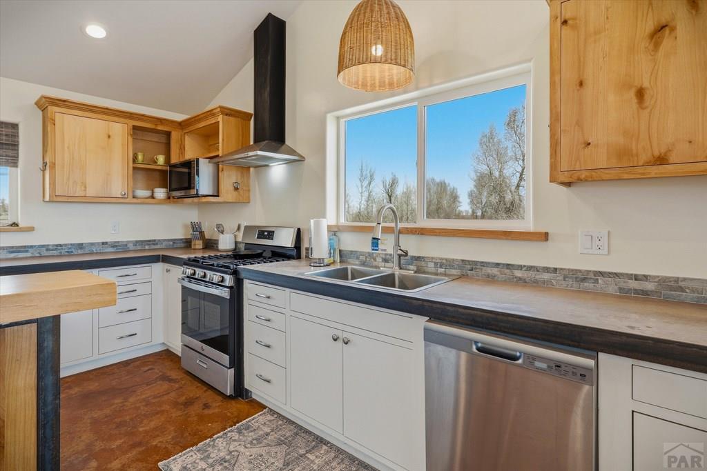 14285 County Rd E 5 Antonito, CO 81120 - Photo 13 of 72 a kitchen with stainless steel appliances granite countertop a sink a stove and cabinets