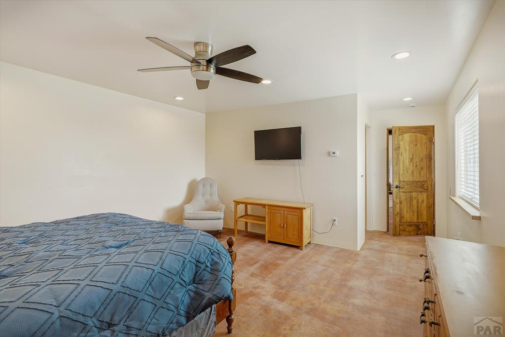 14285 County Rd E 5 Antonito, CO 81120 - Photo 17 of 72 a bedroom with a bed and wooden floor