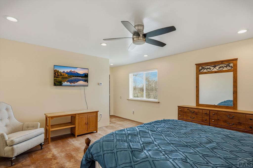 14285 County Rd E 5 Antonito, CO 81120 - Photo 18 of 72 a bedroom with a bed and a couch