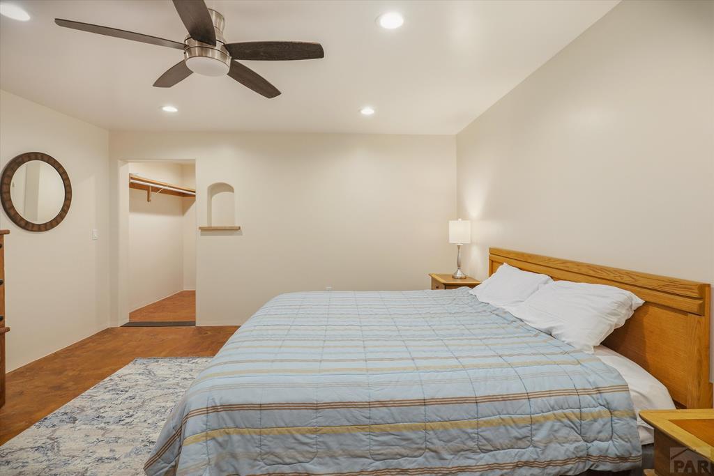 14285 County Rd E 5 Antonito, CO 81120 - Photo 31 of 72 a bedroom with a bed and a chandelier
