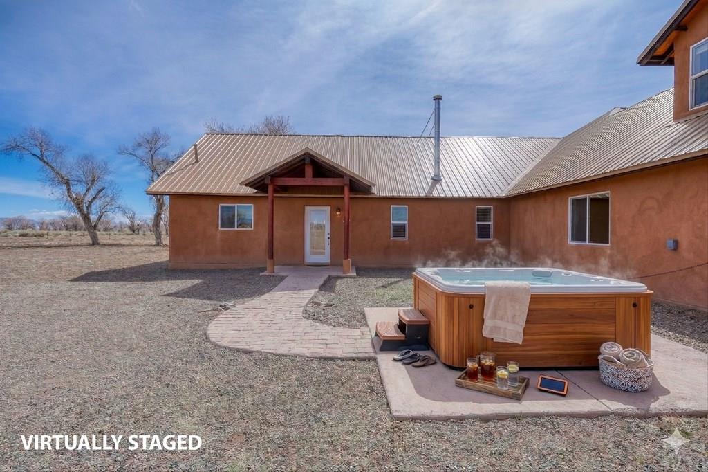 14285 County Rd E 5 Antonito, CO 81120 - Photo 7 of 72 a front view of a house with a yard