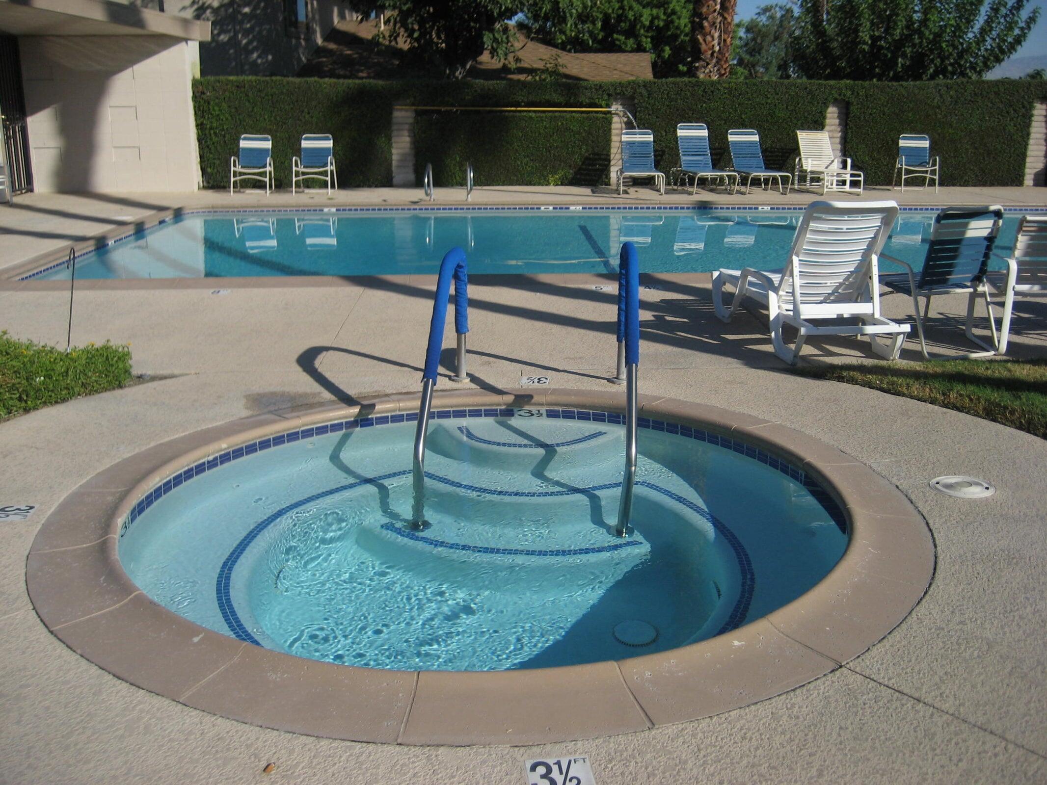72631 Thrush Road, Unit 2 Palm Desert, CA 92260 - Photo 18 of 20 a view of a swimming pool with a chairs
