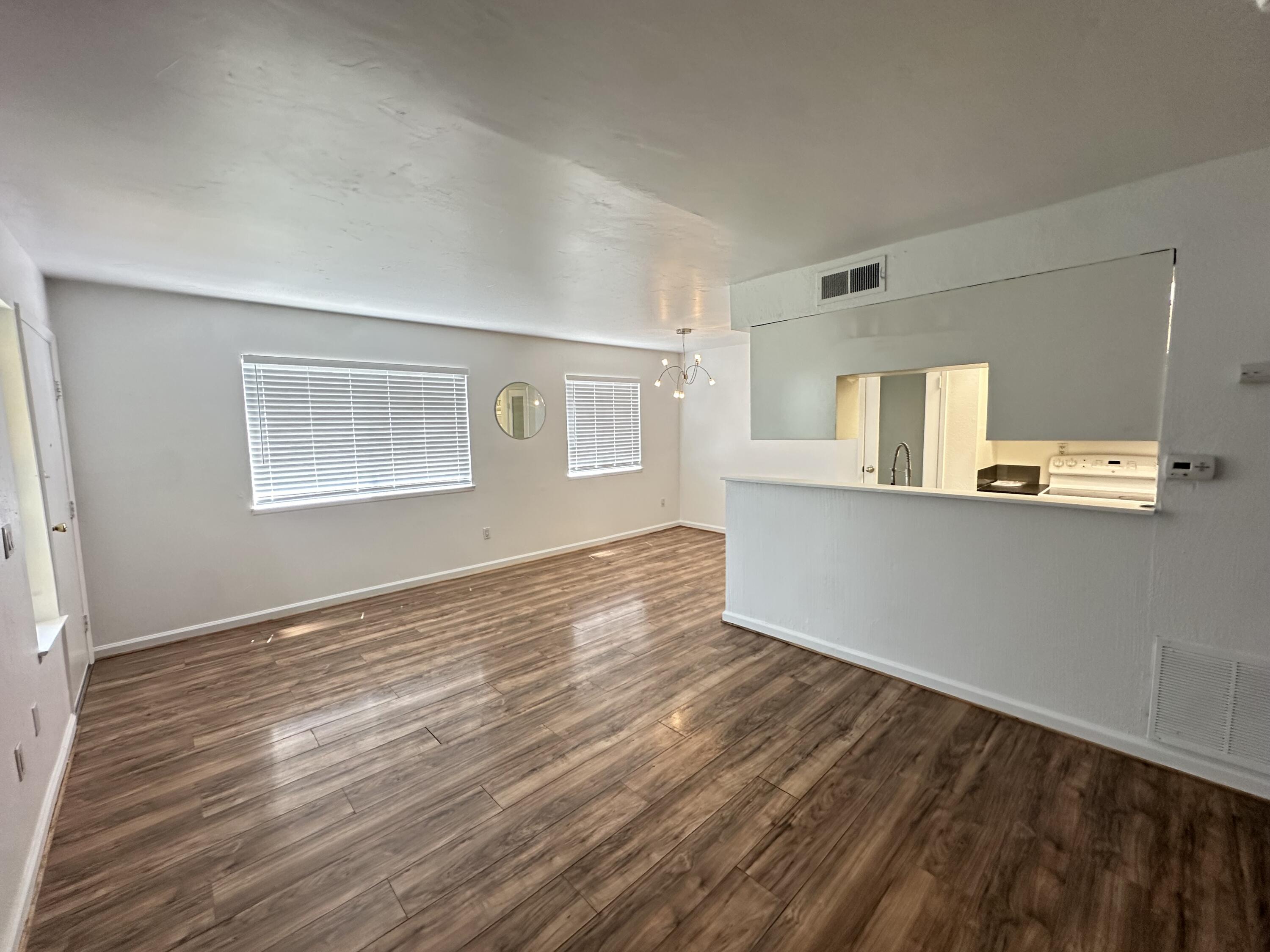 72631 Thrush Road, Unit 2 Palm Desert, CA 92260 - Photo 3 of 20 a view of a kitchen with wooden floor and a window