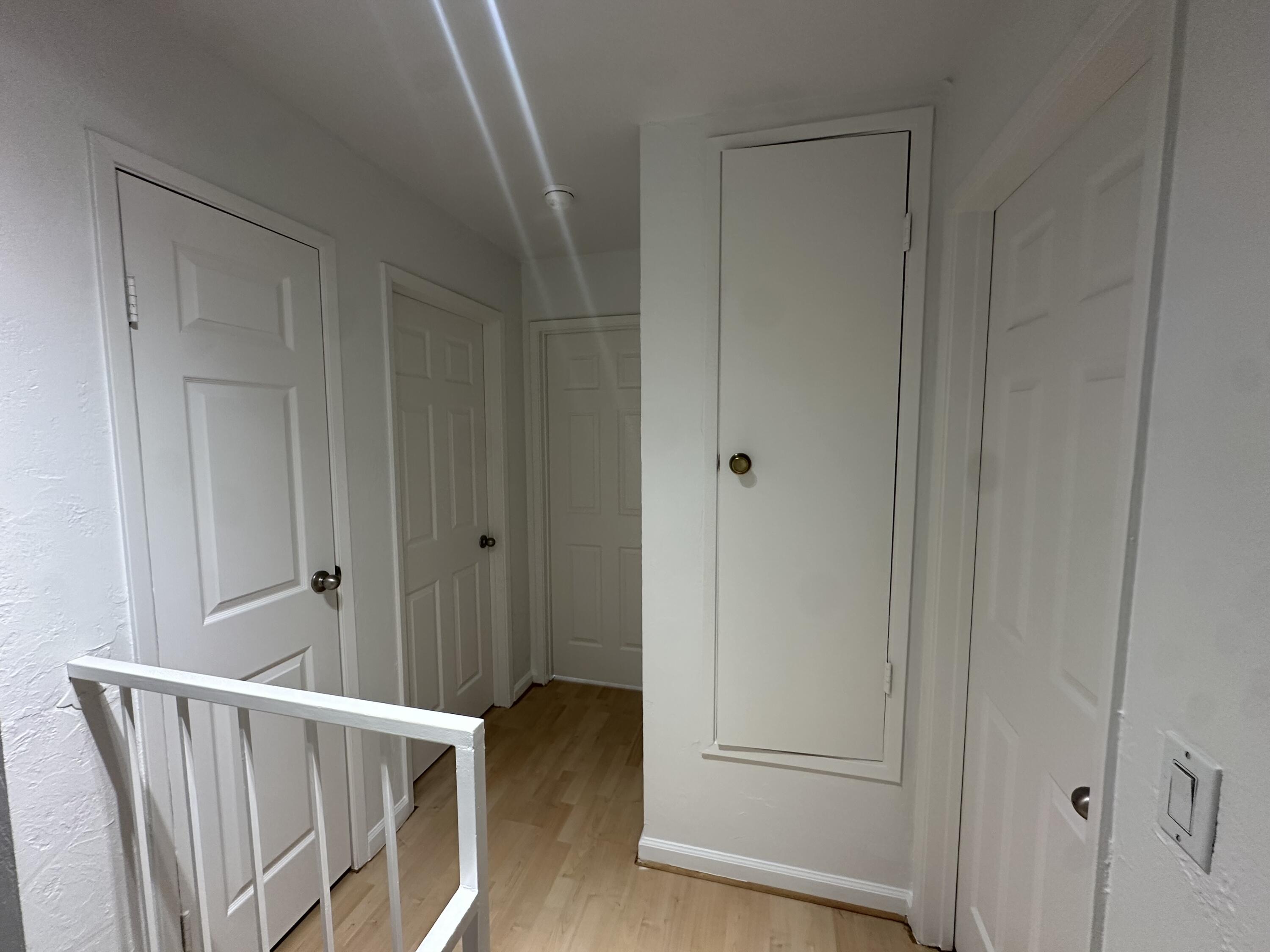 72631 Thrush Road, Unit 2 Palm Desert, CA 92260 - Photo 7 of 20 a view of a hallway with wooden floor and staircase