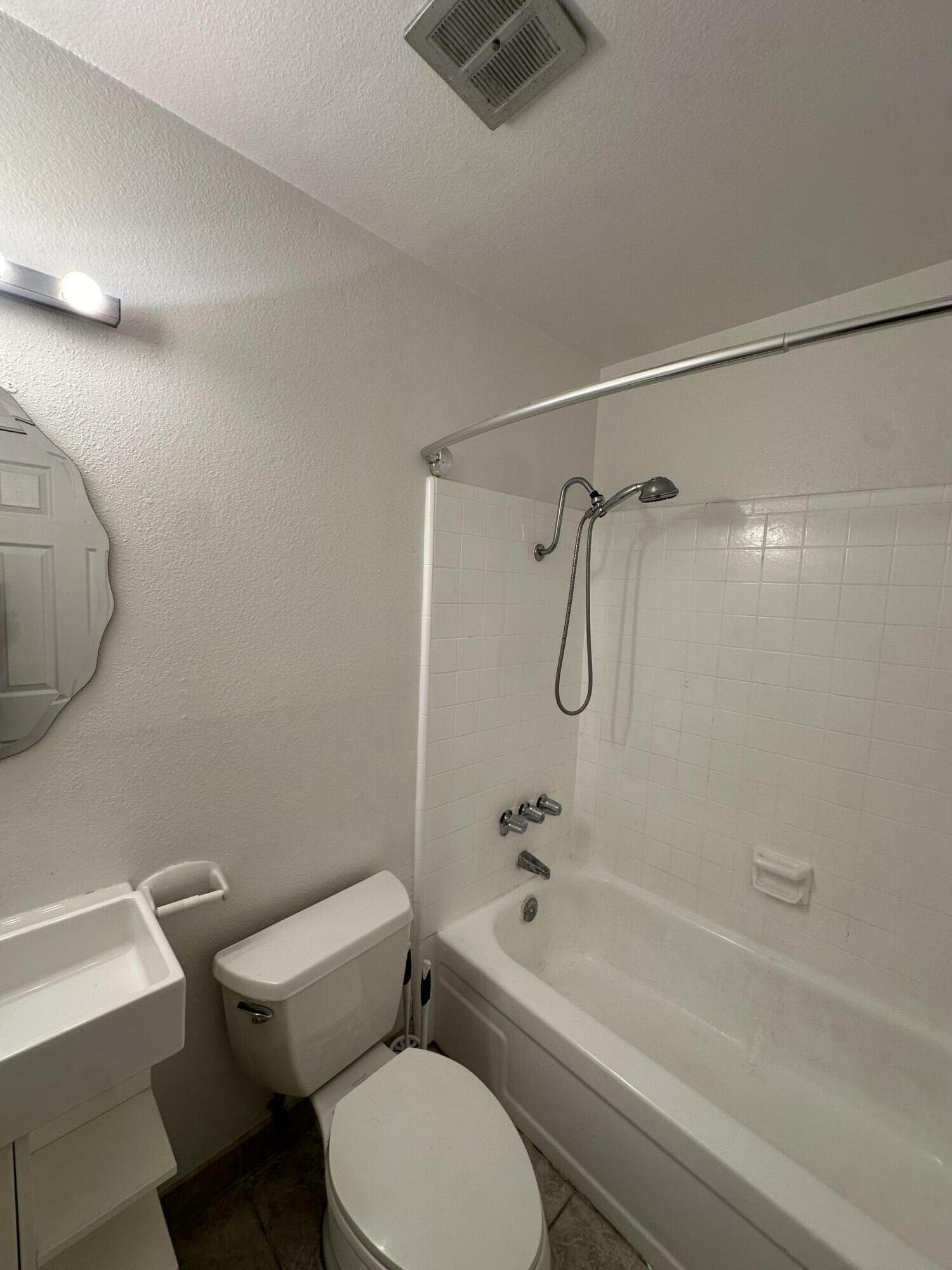 72631 Thrush Road, Unit 2 Palm Desert, CA 92260 - Photo 9 of 20 a bathroom with a toilet a sink and shower
