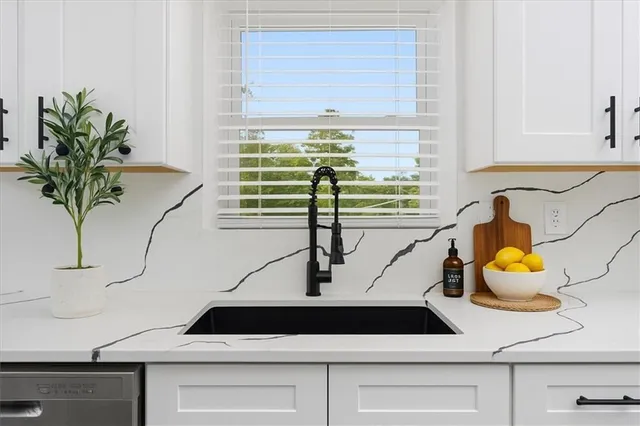 a kitchen with a table chairs and a refrigerator