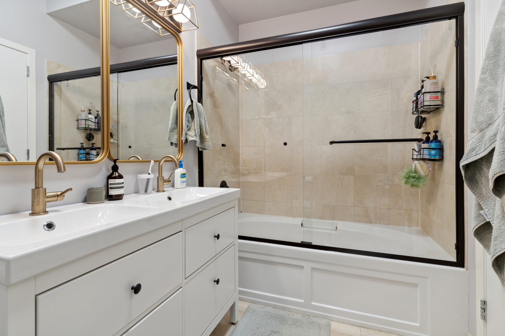 321 South Sangamon Street, Unit 603 Chicago, IL 60607 - Photo 11 of 12 a bathroom with a shower sink and mirror