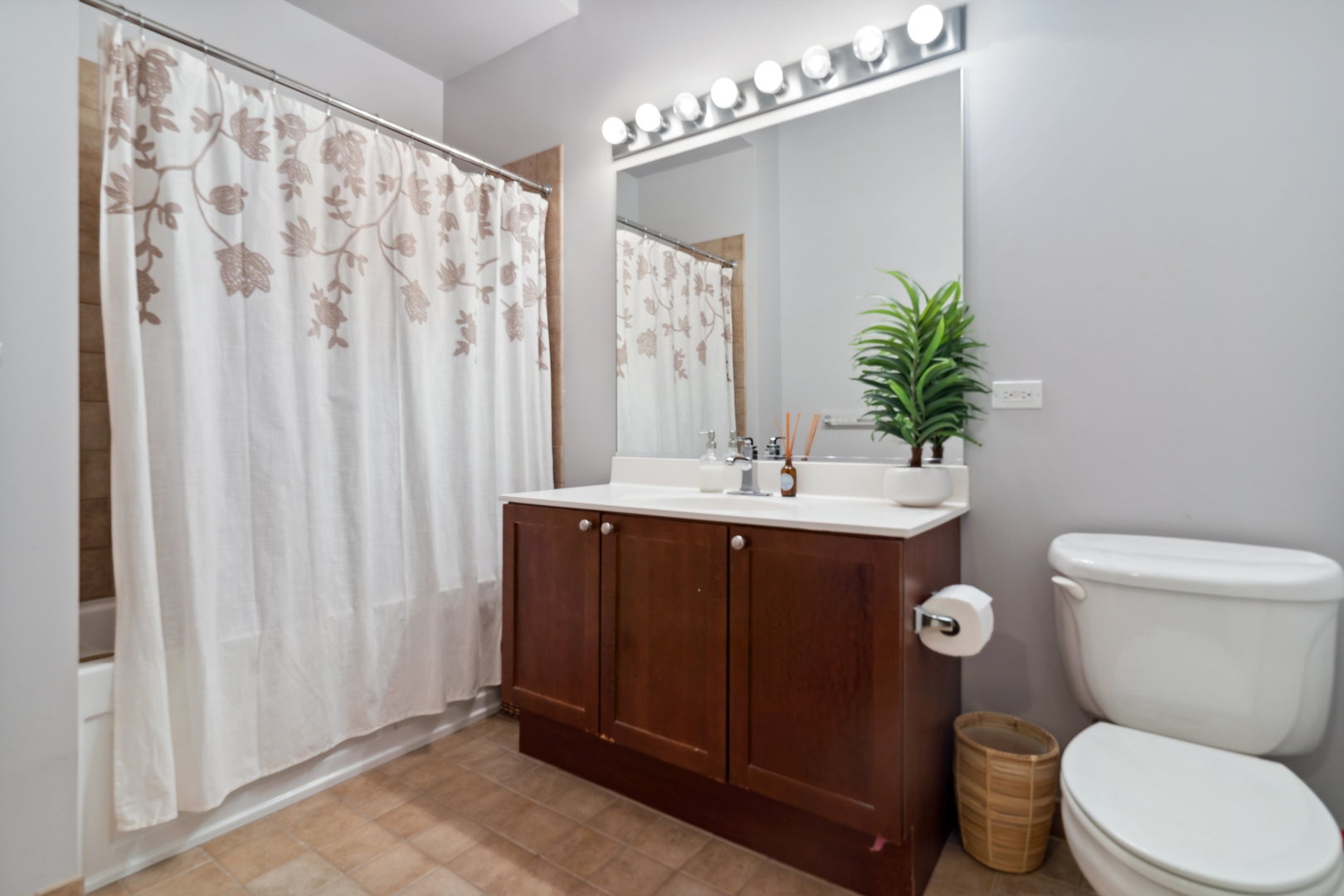 321 South Sangamon Street, Unit 603 Chicago, IL 60607 - Photo 3 of 12 a bathroom with a sink vanity mirror and toilet