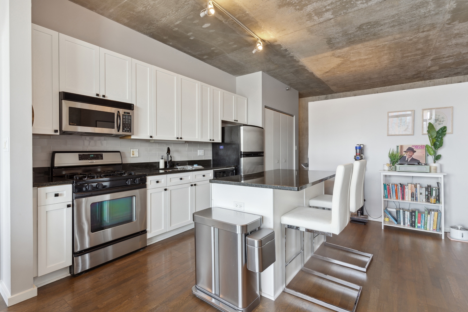 321 South Sangamon Street, Unit 603 Chicago, IL 60607 - Photo 7 of 12 a kitchen with stainless steel appliances a stove microwave and a refrigerator