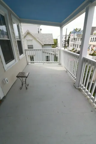 a view of a porch with furniture