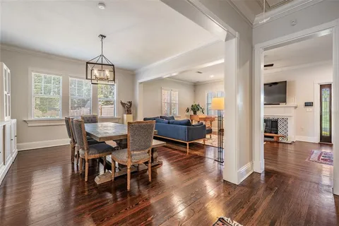 a view of a dining room with furniture window and wooden floor