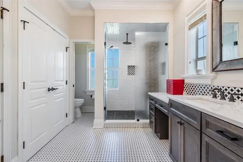 a bathroom with a sink a vanity and a mirror