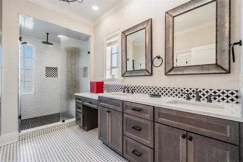 a bathroom with a sink a toilet and a shower