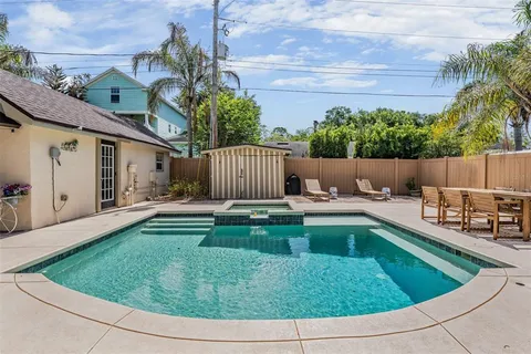 a view of a backyard with a tub