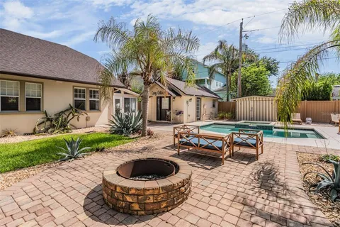 a backyard of a house with plants and trees