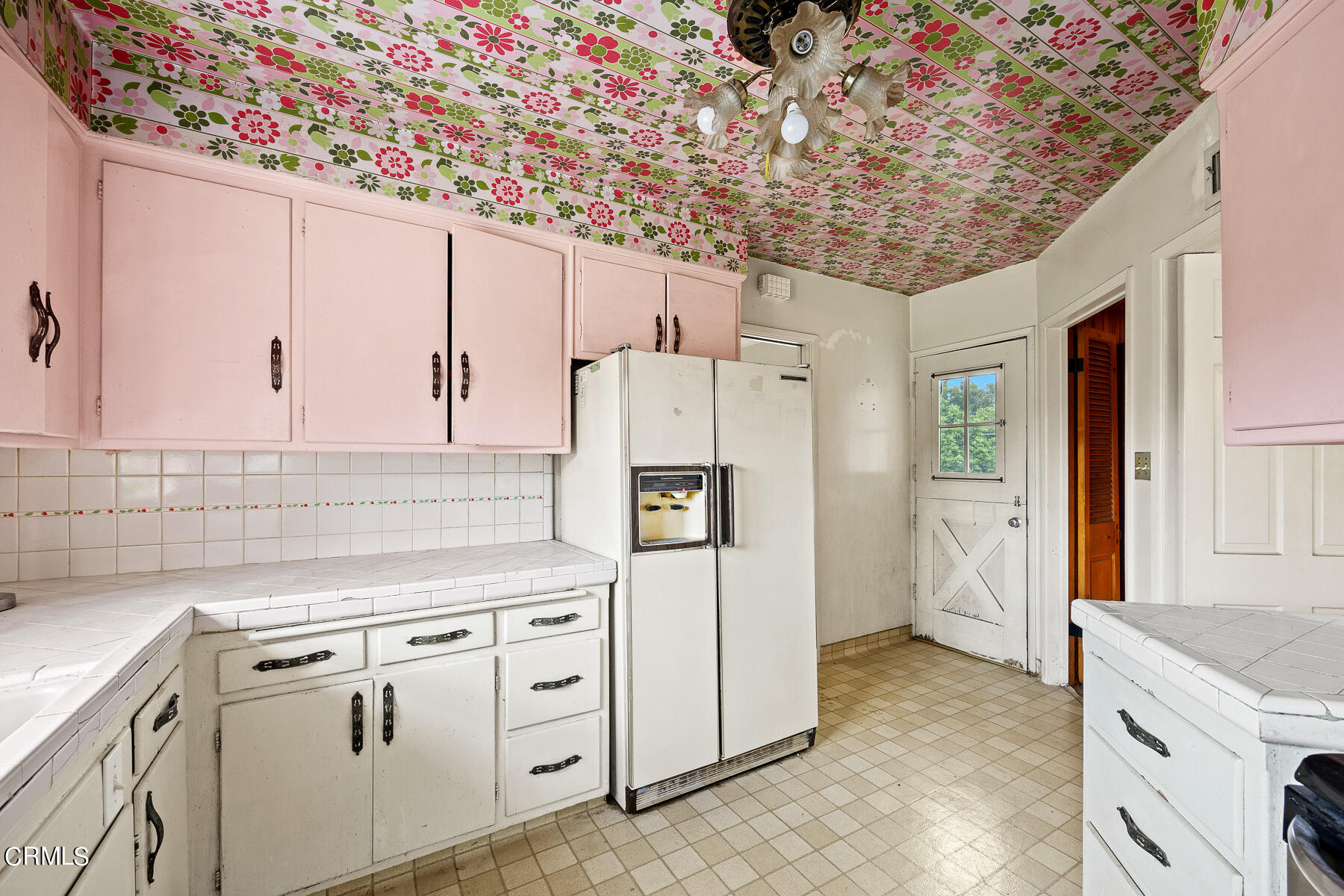 3570 Lombardy Road Pasadena, CA 91107 - Photo 16 of 45 a kitchen with cabinets and white stainless steel appliances