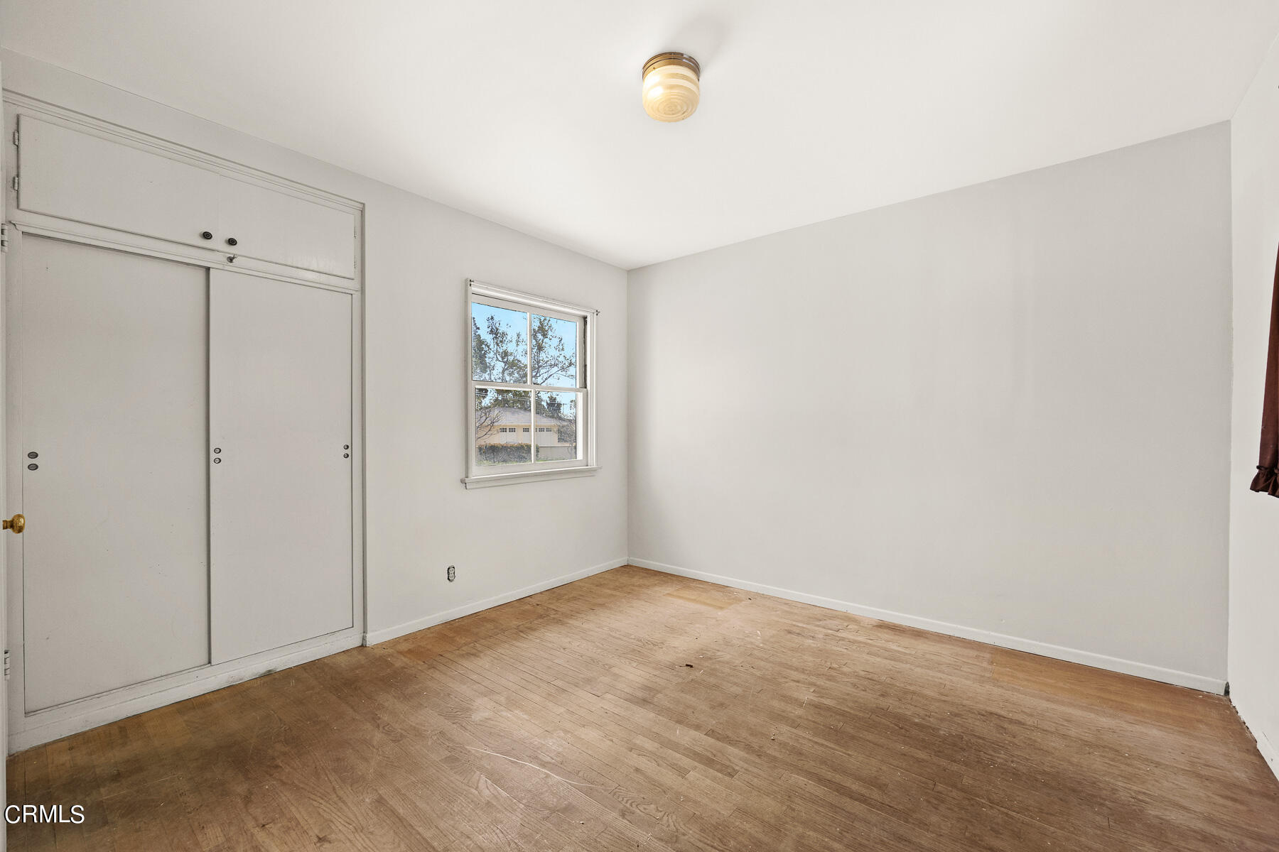 3570 Lombardy Road Pasadena, CA 91107 - Photo 19 of 45 an empty room with windows