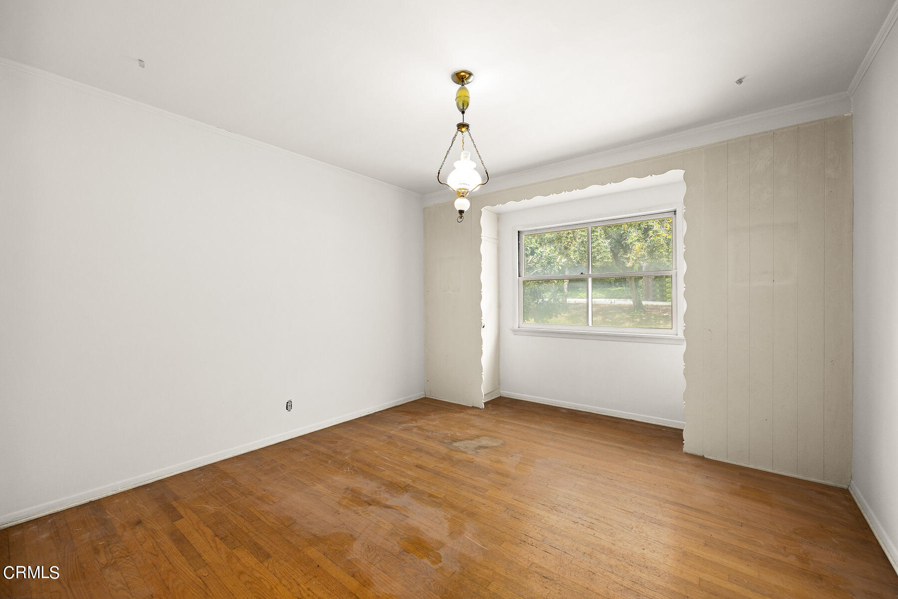 3570 Lombardy Road Pasadena, CA 91107 - Photo 25 of 45 an empty room with wooden floor chandelier and windows