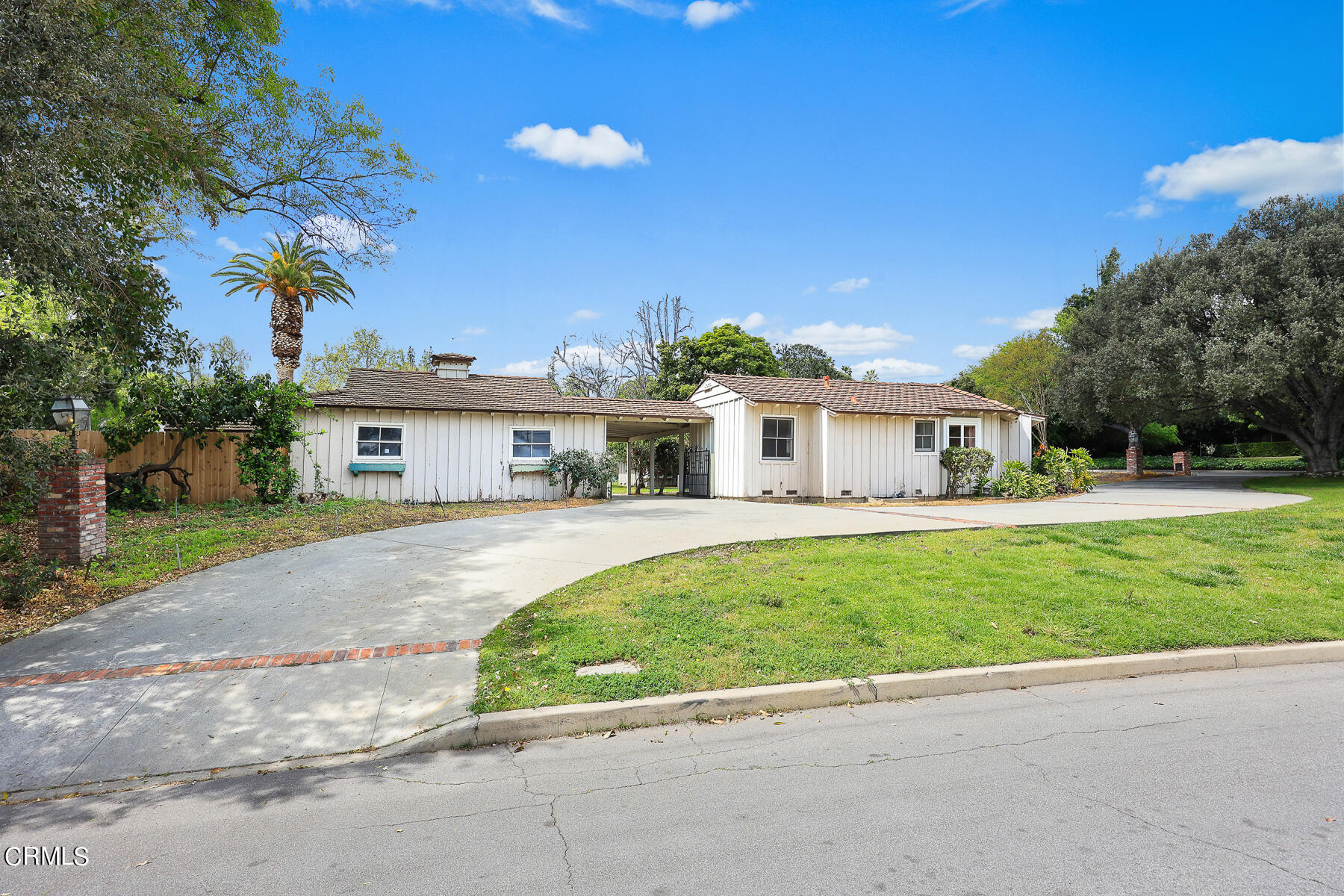 3570 Lombardy Road Pasadena, CA 91107 - Photo 38 of 45 a front view of a house with a yard and potted plants