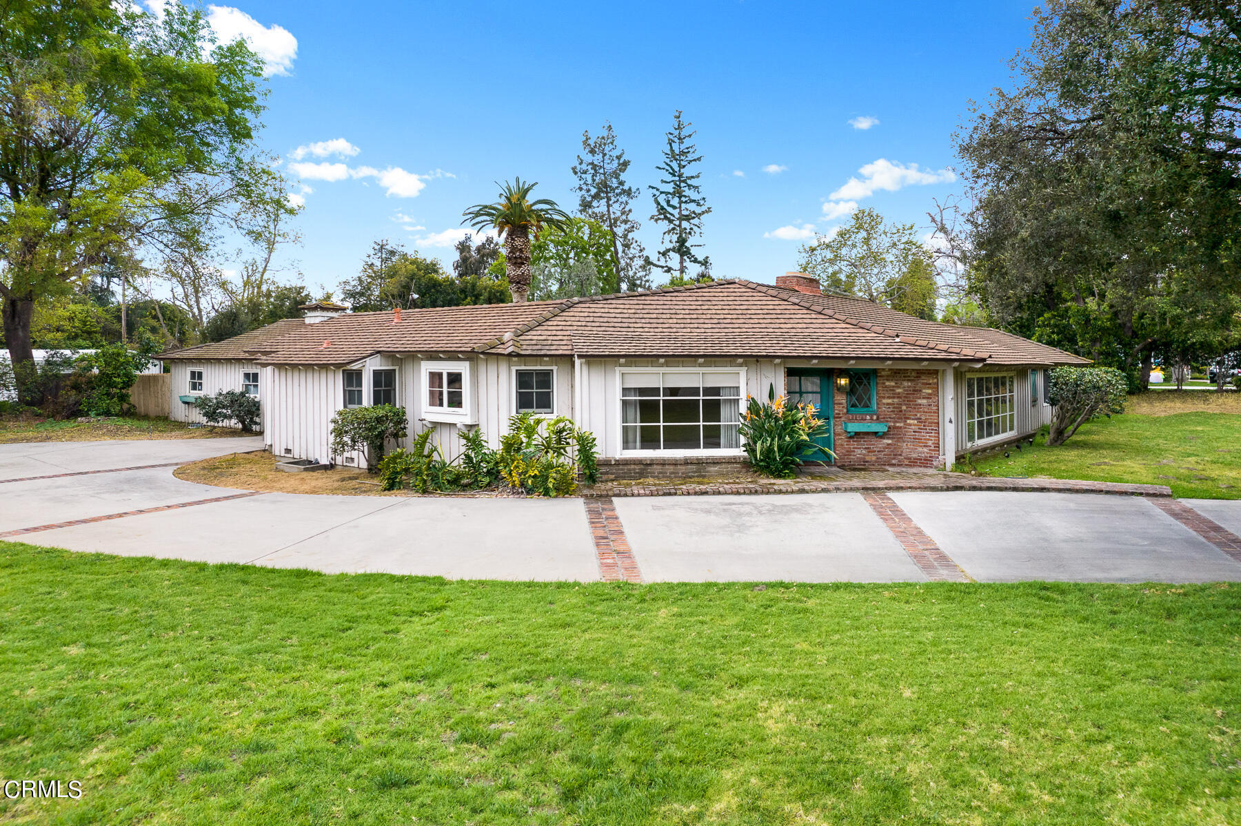 3570 Lombardy Road Pasadena, CA 91107 - Photo 8 of 45 a front view of a house with a yard and garage