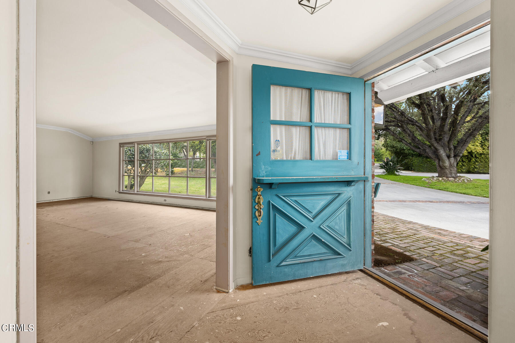 3570 Lombardy Road Pasadena, CA 91107 - Photo 10 of 45 a view of an empty room with a window and a fireplace