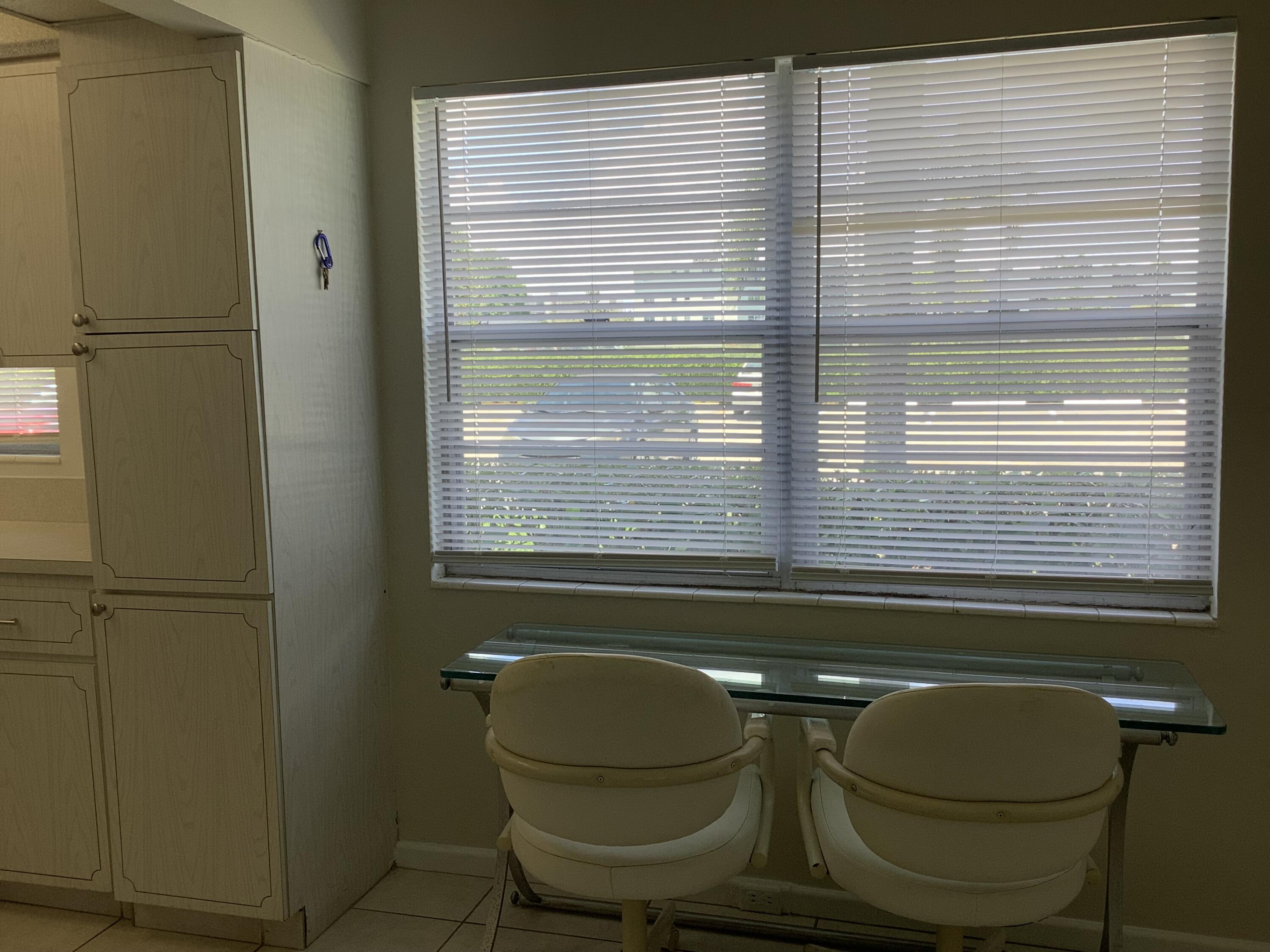 560 Fanshaw North, Unit 560 Boca Raton, FL 33434 - Photo 23 of 26 a bathroom with a sink a toilet and a window